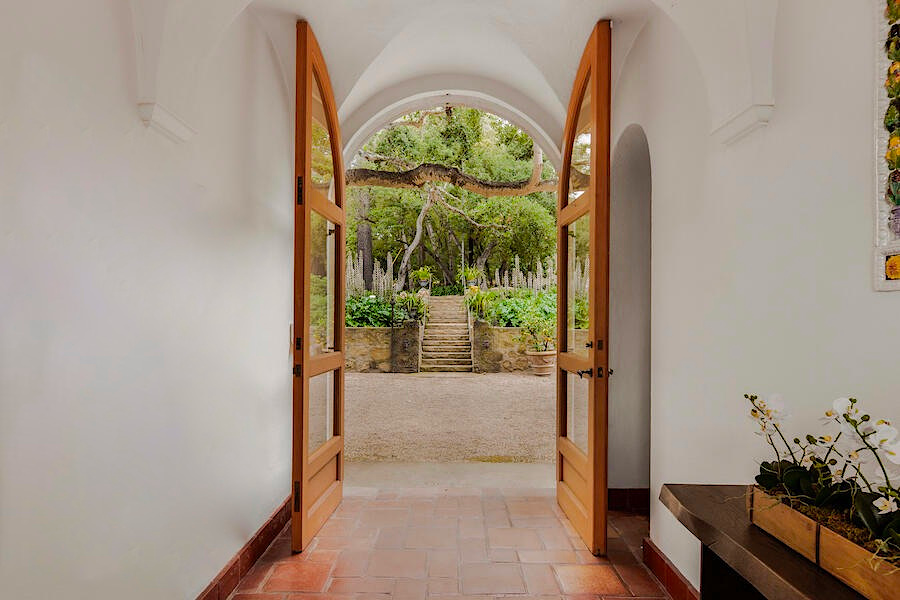 Southern California Tuscan villa cross vaulted gallery with red tile floor