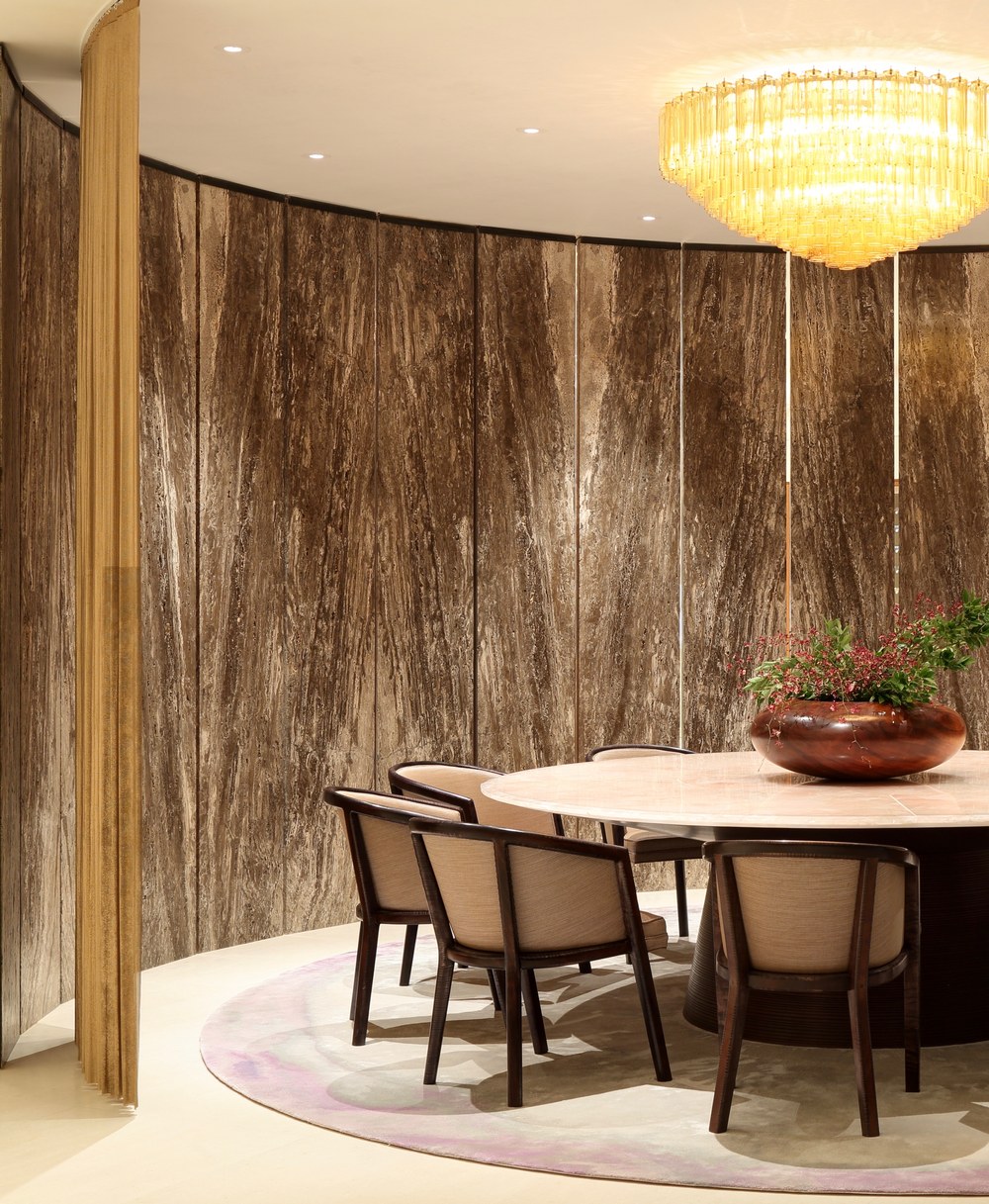 Dining room with marble wall panels and gold mesh curtain at Henry Kaiser estate in Hawaii