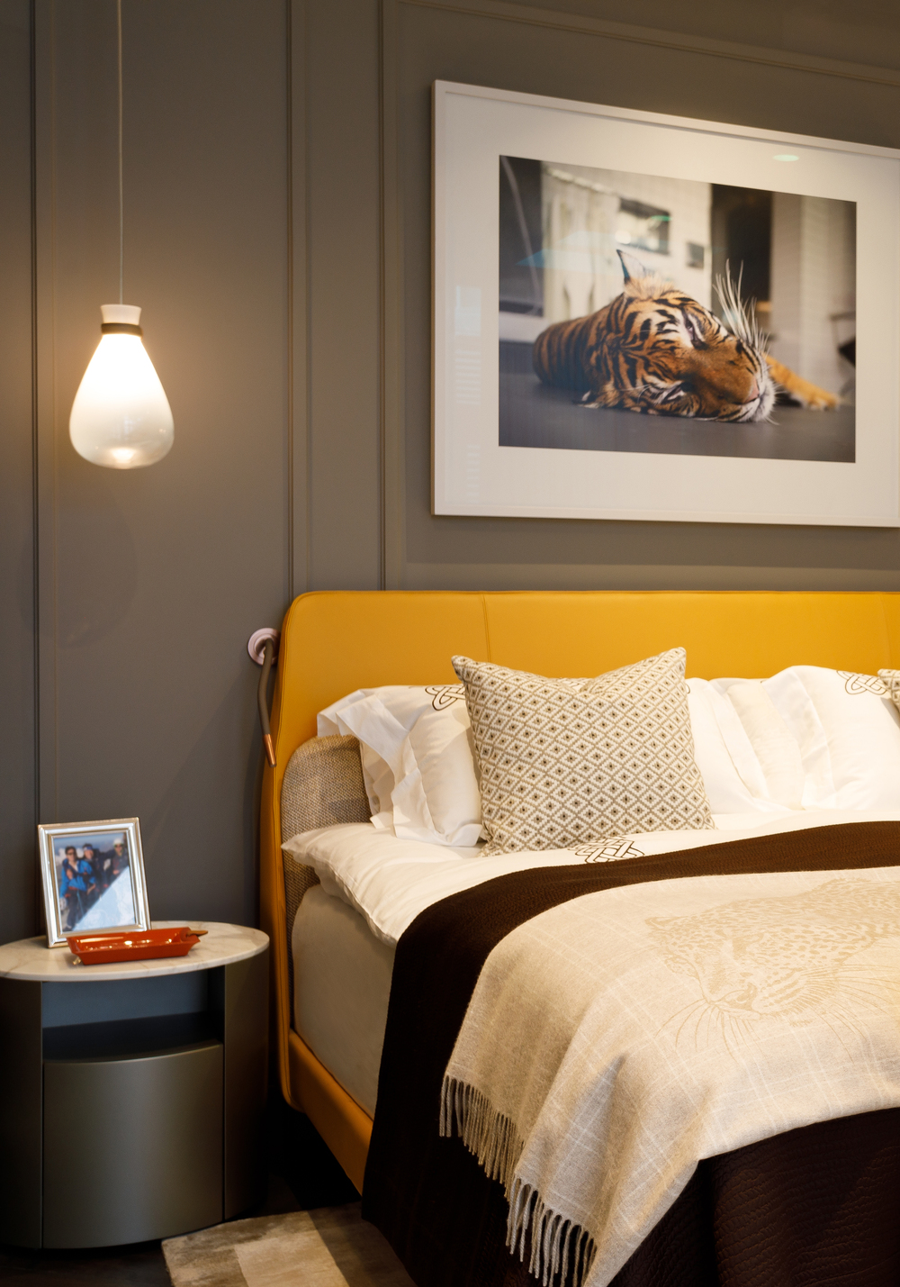 Bedroom of Grade II listed house in Ennismore Gardens, Knightsbridge, London with Poltrona Frau leather bed and Thomas Struth Sumatra-Tiger (Panthera tigris sumatrae), Leibniz IZW, Berlin, 2022