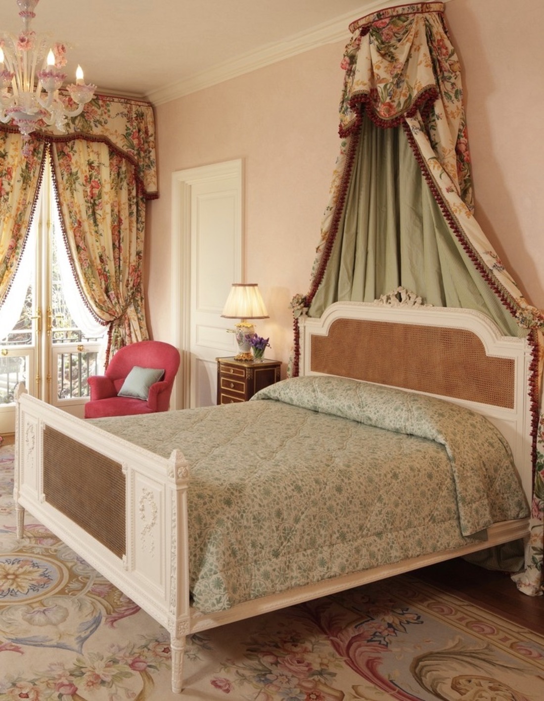 Pink Venetian plaster guest bedroom with Murano glass chandelier
